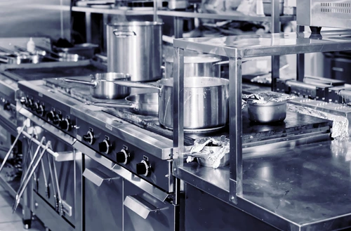 Modern commercial kitchen in a restaurant, with appliances and other equipment.