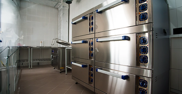 A picture of a row of commercial ovens.
