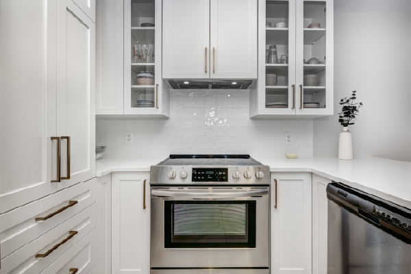 Image of an oven in a white kitchen.