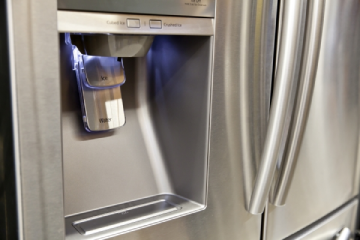 Refrigerator showing ice maker door.