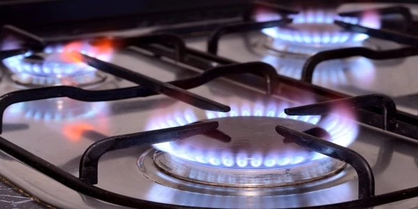 closeup of lit gas stove