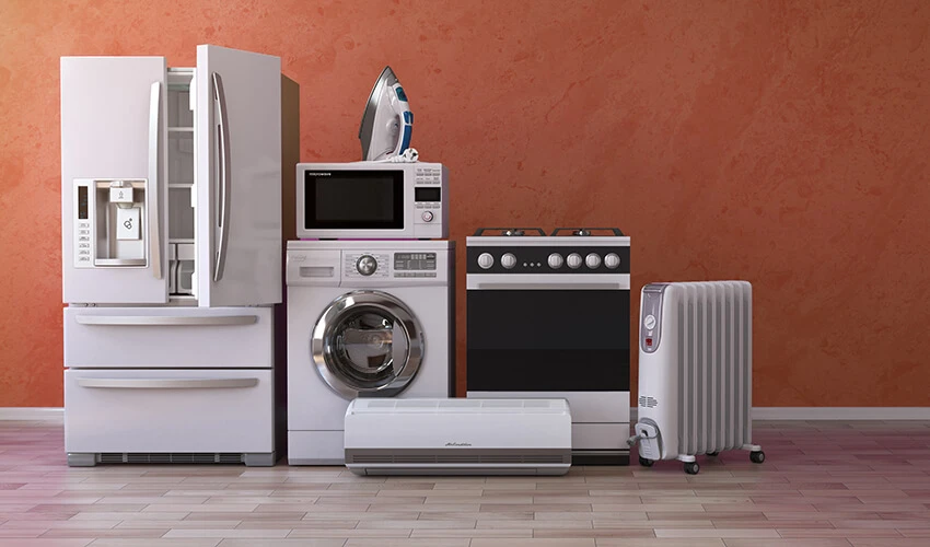 "Refrigerator, dryer, microwave, stove, and other appliances lined against a wall
