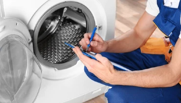 MRA Technician repairing washing machine