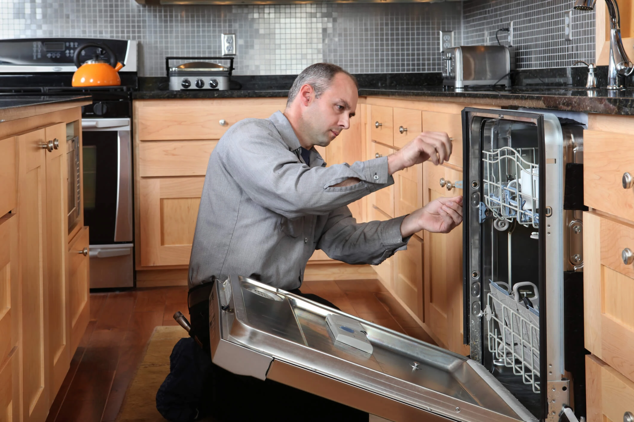 Dishwasher being serviced
