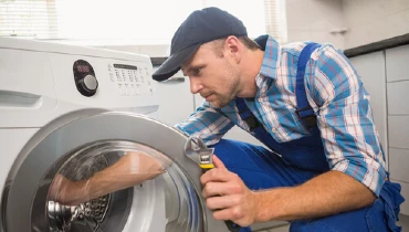 MRA Technician repairing washing machine