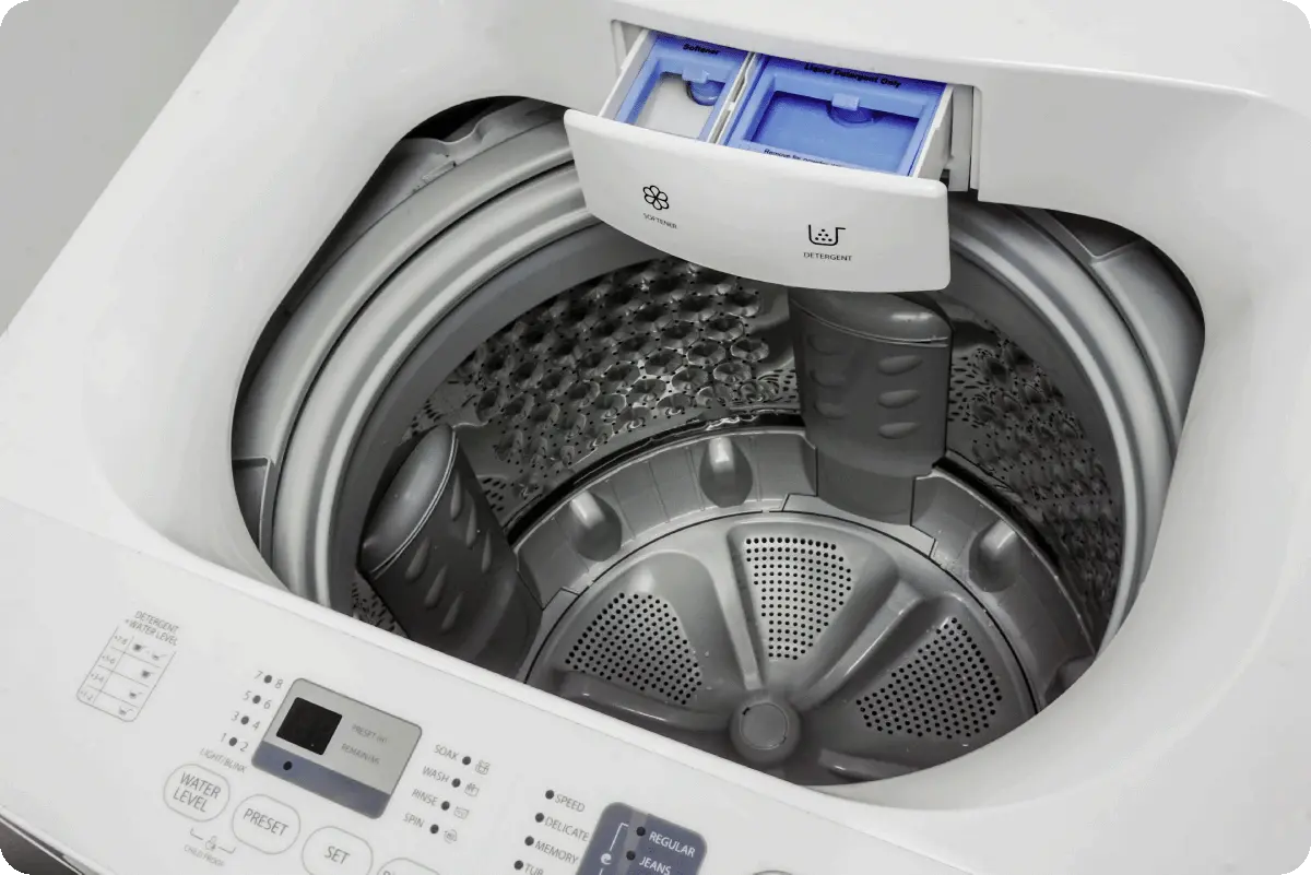 Above view of the interior of a white top-load washer.