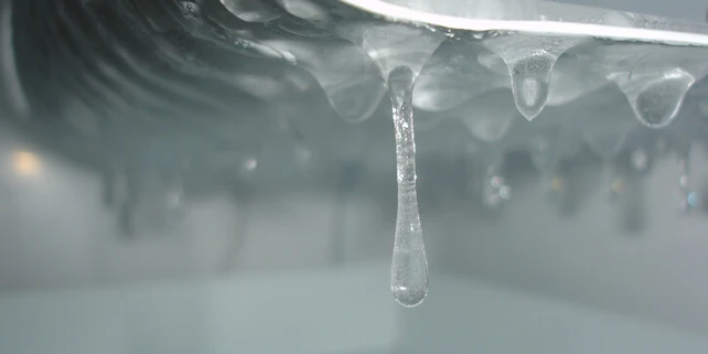 Frozen water in ice maker