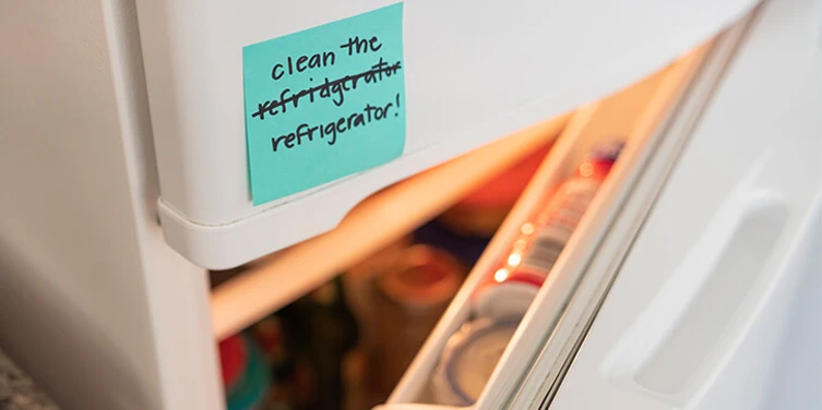 Sticky note on an open refrigerator