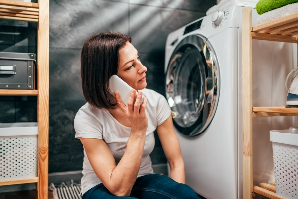 Women Fixing a Washing Machine