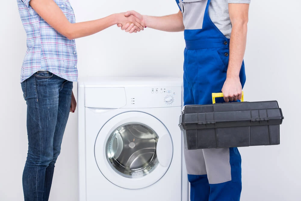 Client Shaking Hands with Service Technician