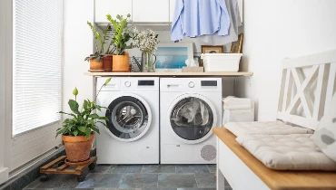 Front shot of a washer and dryer in a clean and organized laundry room | Mr. Appliance of Memphis