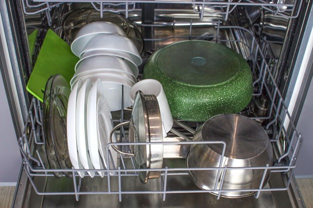 Clean dishes inside dishwasher.
