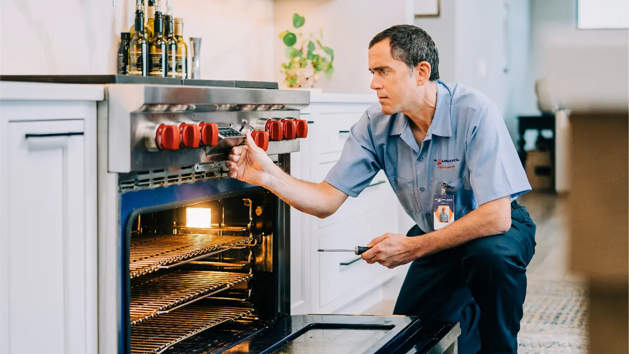 Mr. Appliance oven repairman repairing a range in Port Charlotte, FL