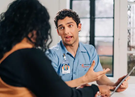 Mr. Appliance professional having a conversation with a customer